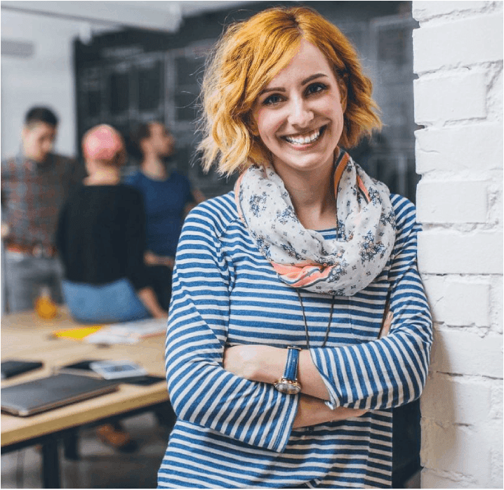 A woman standing in front of a group of people.