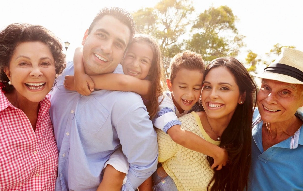 A family of four posing for the camera.